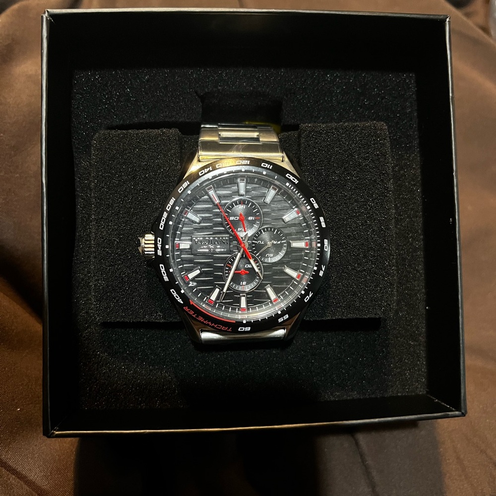 Invicta Black and Silver Watch with Red Accents